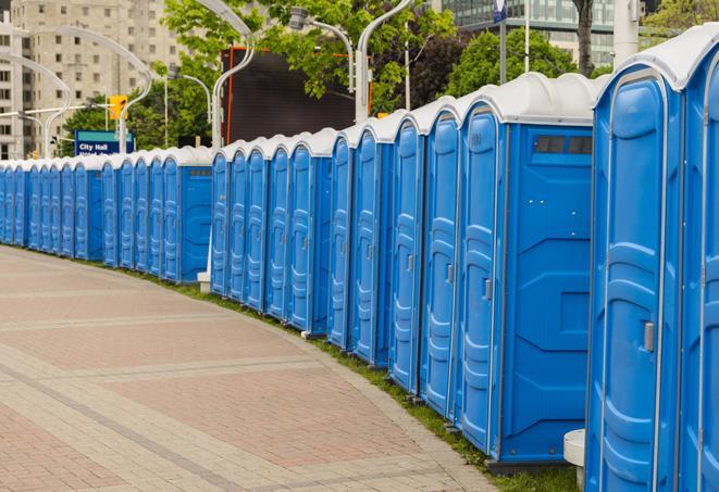 a row of sleek and modern portable restrooms at a special outdoor event in Champlin